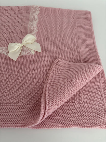 Manta rosa empolvado