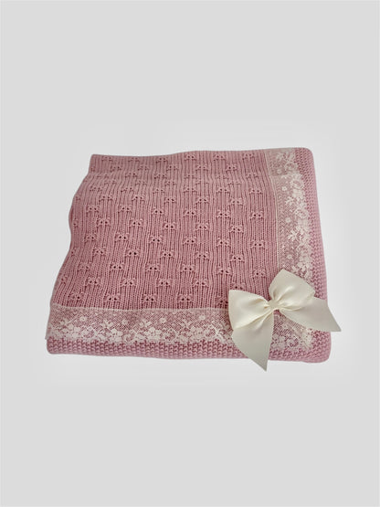 Manta rosa empolvado